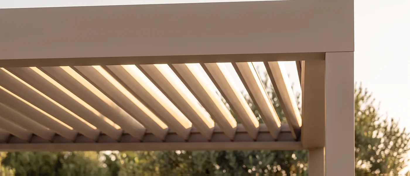 Louvered roof blades at pitch, meeting the fascia and post