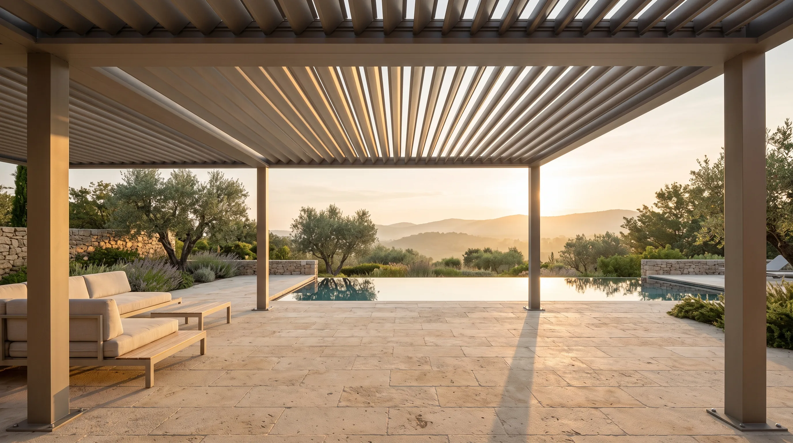 Louvered pergola over an estate terrace at first light, low sun reading through the open blades